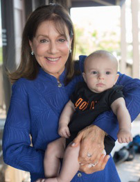 Dr Boxer holding a baby